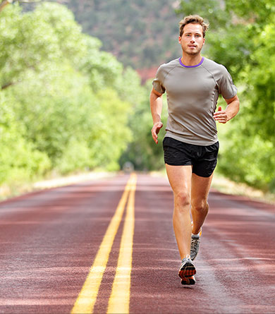 Sport and fitness runner man running on road